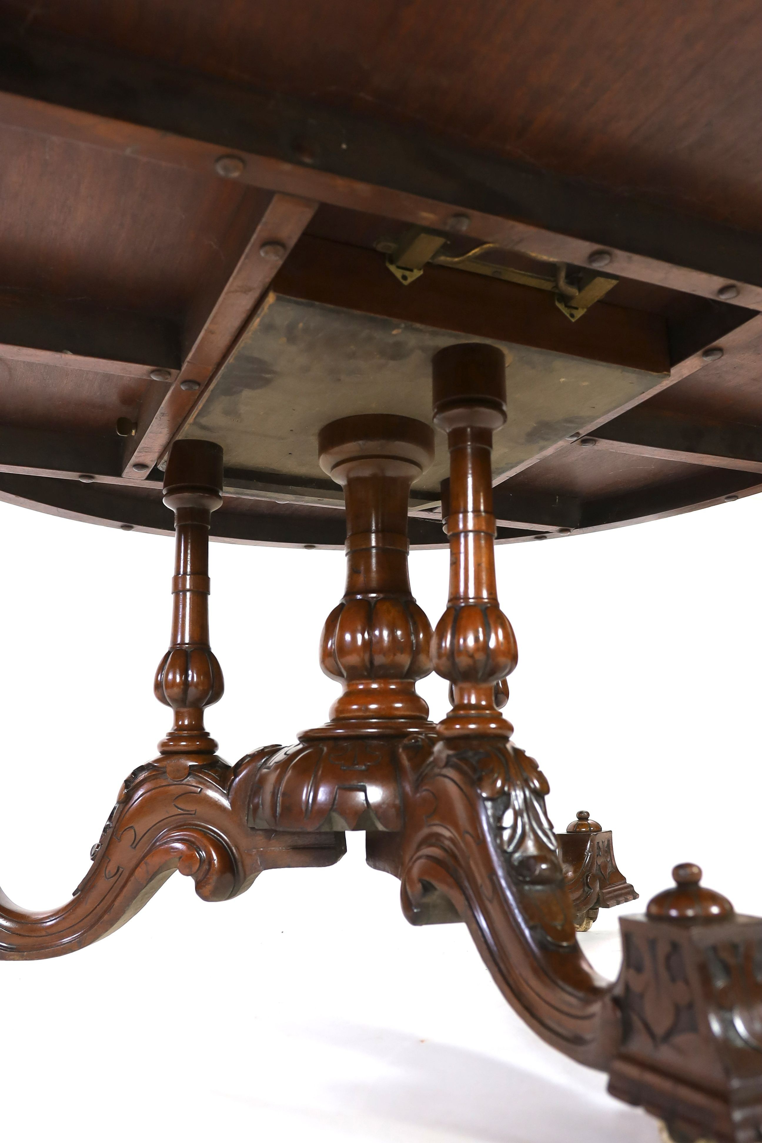 A Victorian walnut and marquetry breakfast table, diameter 144cm H.77cm